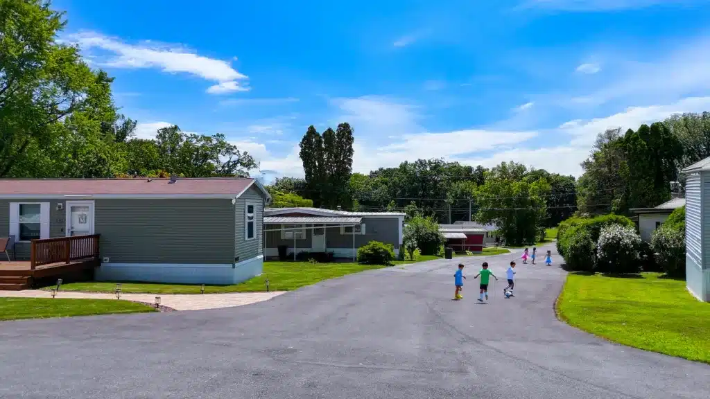 Children playing in a quiet manufactured home community street in Pennsylvania
